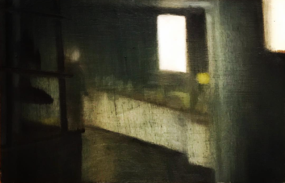 Empty interior crossed by light and shadow